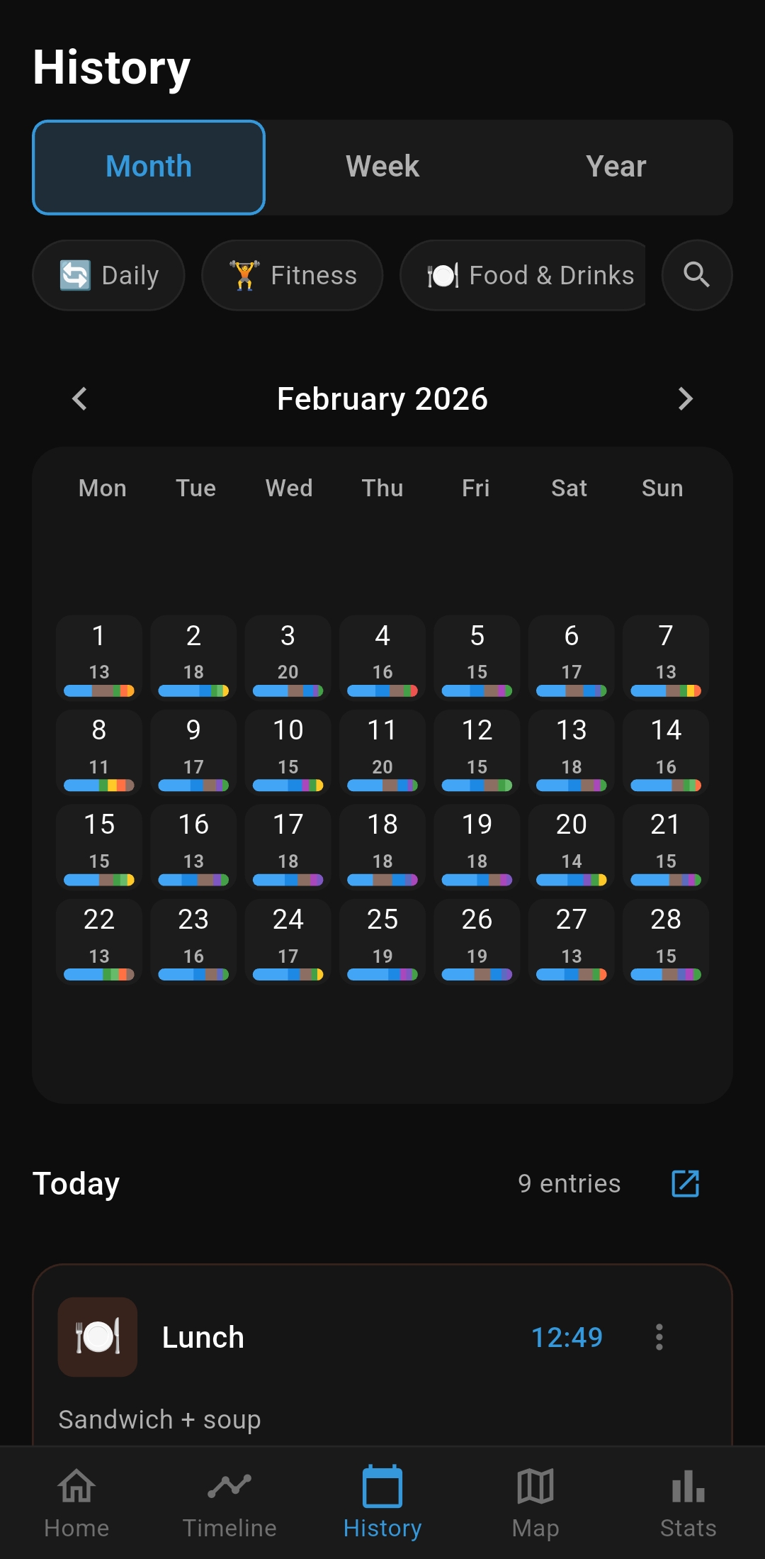 Month calendar with colored activity stripes per day